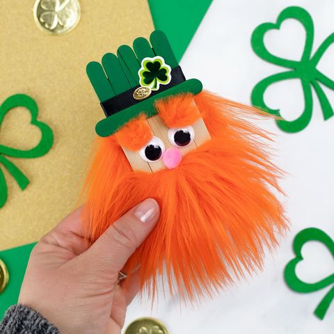 st patrick's day crafts craft stick leprechaun with a green hat and orange beard