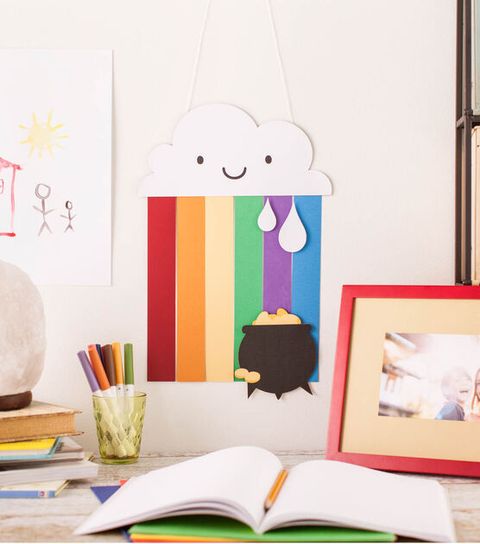 st patricks day crafts rainbow banner with a smiling cloud and pot of gold hanging on the wall