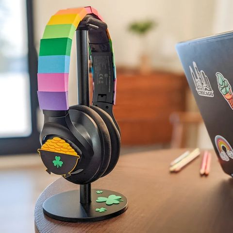 headphones adorned with a rainbow of paper strips with a pot of gold on either end for an easy st patrick's day craft