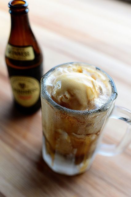 guinness float in pint glass with beer bottle