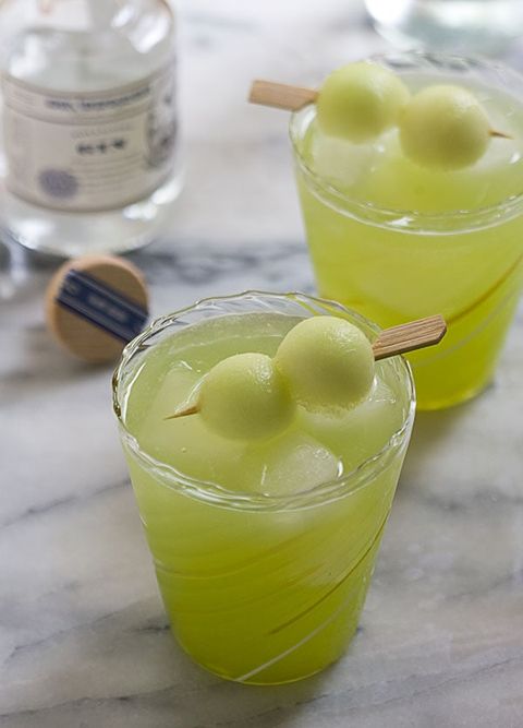 melon gin and tonic with honeydew melon balls on toothpick