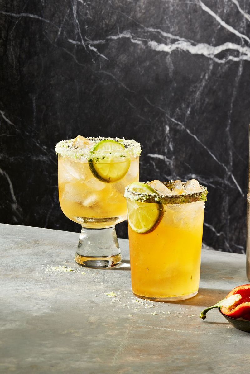 two spicy margarita glasses with lime slices