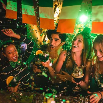 friends partying with drinks and confetti on saint patrick's day that could be captioned shenanigans squad on instagram