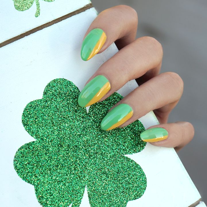 female hands with a green and gold manicure for the st patricks day holiday