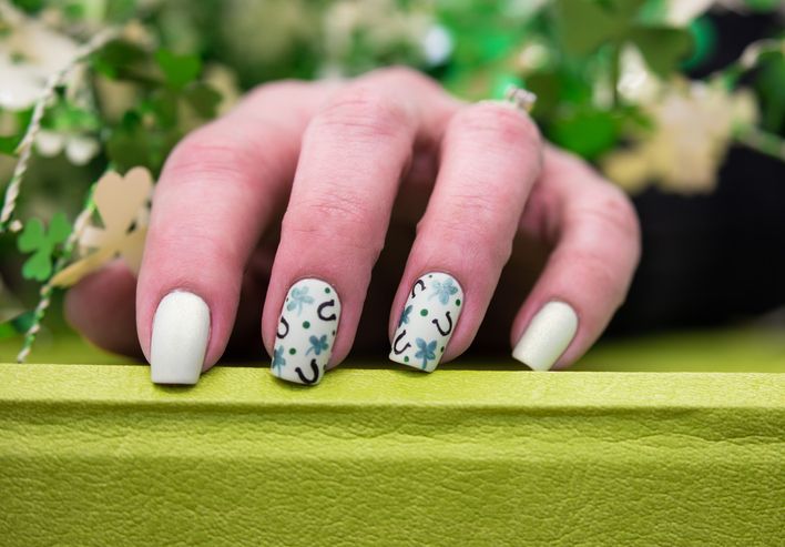 Feminine nail art with nice glitter, green and white nail polish Stock  Photo - Alamy