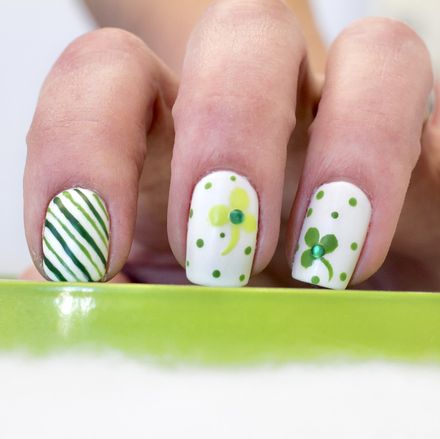 st patricks day inspired nail art with shamrocks and polka dots