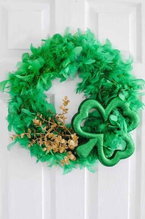 green wreath made of feather boa with shamrock