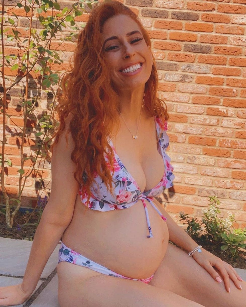 stacey solomon on her hen do, sitting in a bikini and smiling at the camera