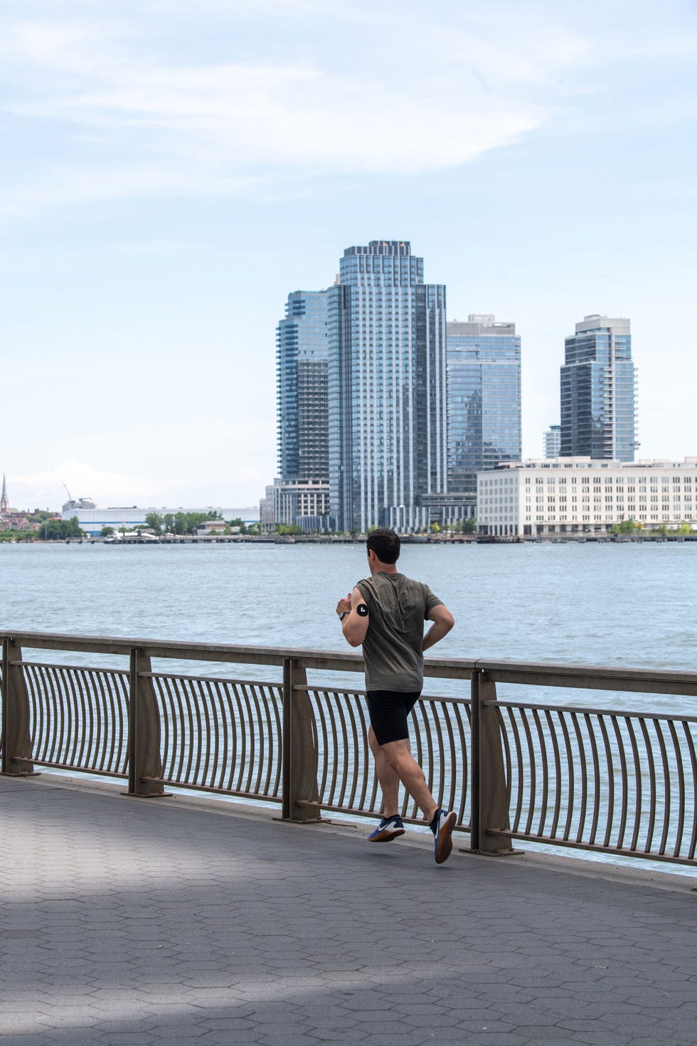 man running along waterfront