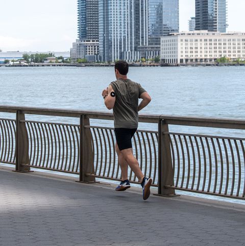 man running along waterfront