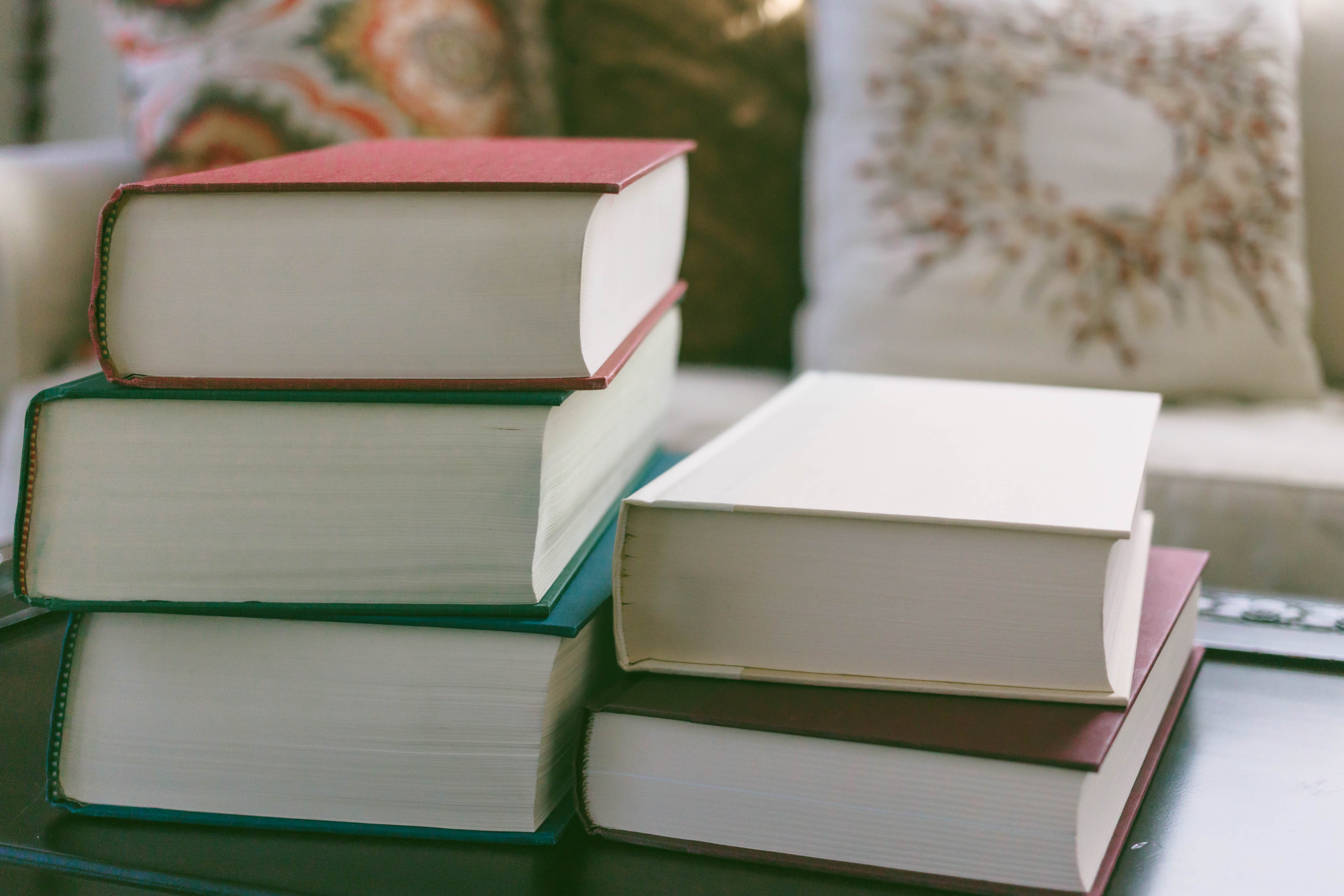 stack of books on coffee table