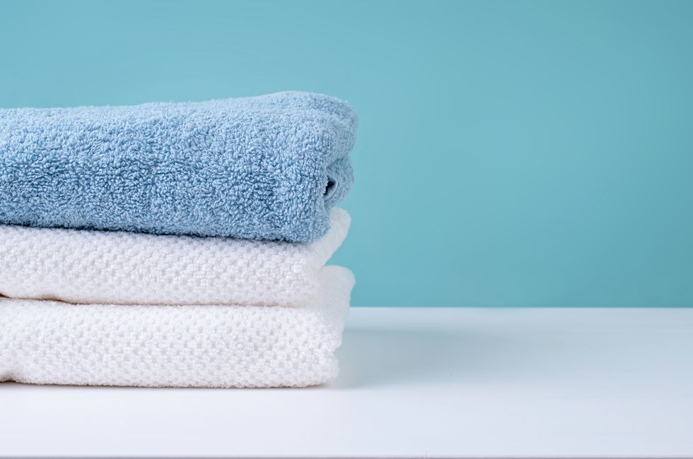 stack of clean towels on blue background,romania