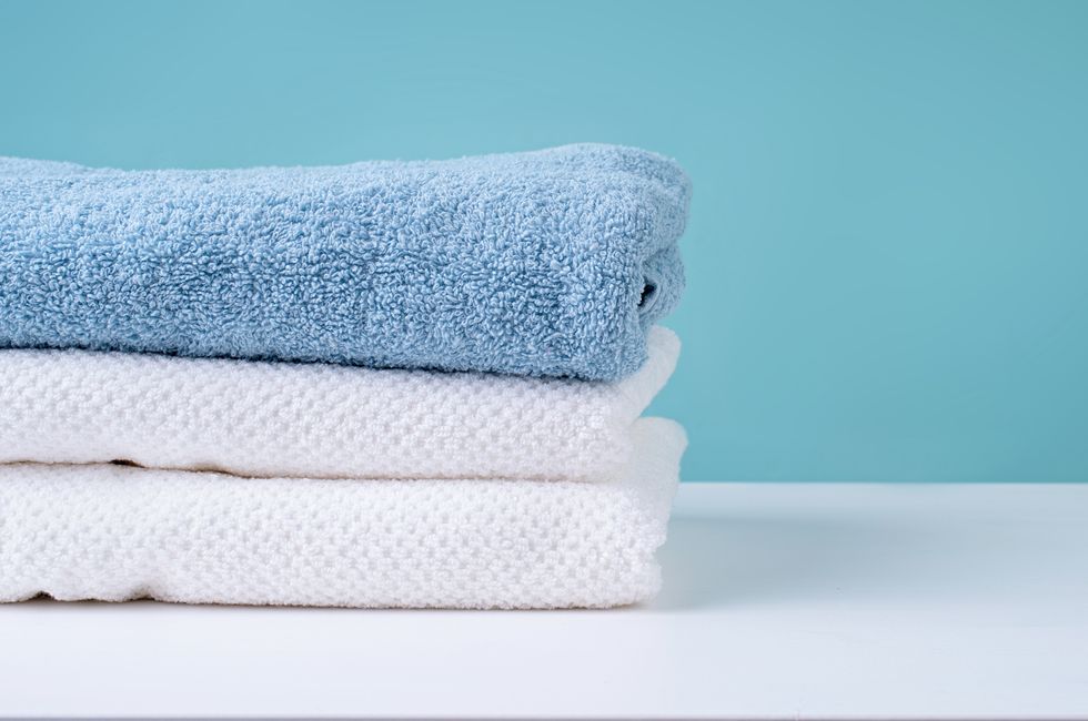 stack of clean towels on blue background,romania
