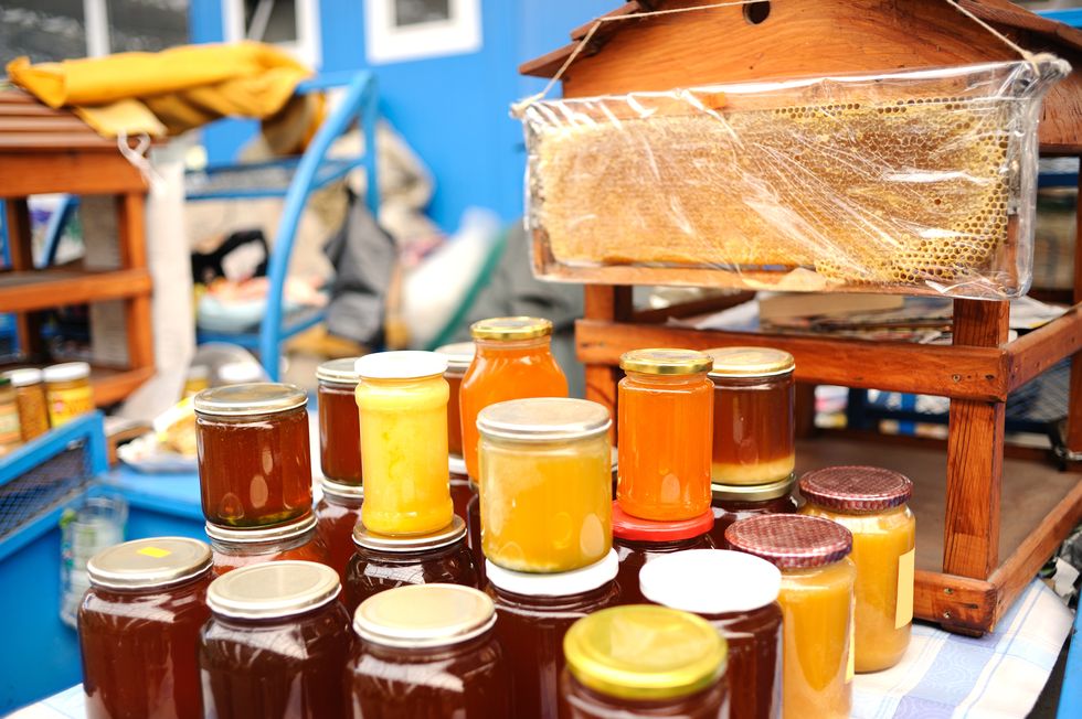 stack of honey at farmer's market