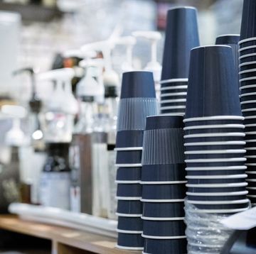 stack of upside down disposable cups at cafe