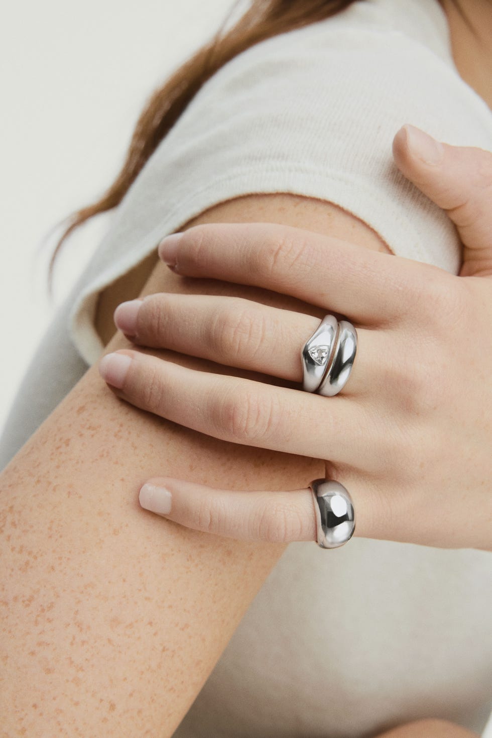 hand with silver rings
