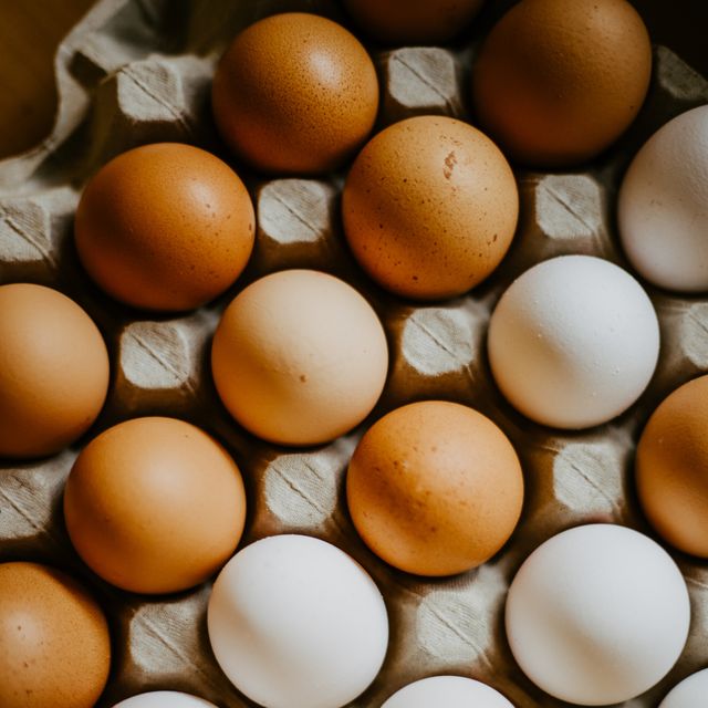 stacks of fresh eggs in egg trays