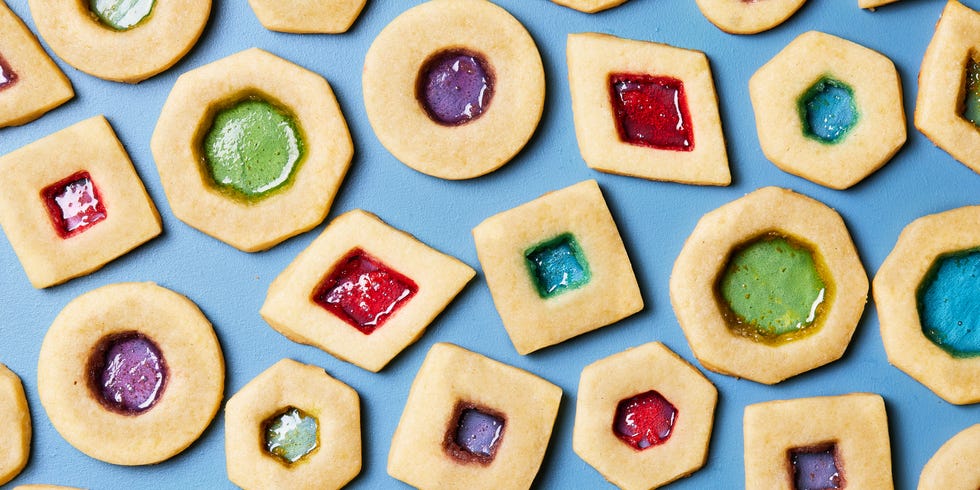 sugar cookies with cutouts filled with melted jolly ranchers to look like stained glass
