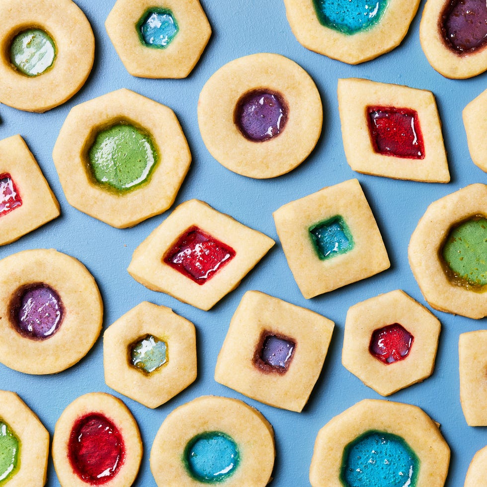 sugar cookies with cutouts filled with melted jolly ranchers to look like stained glass