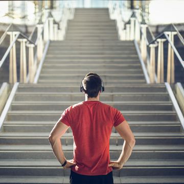 man in red shirt preparing for stair run