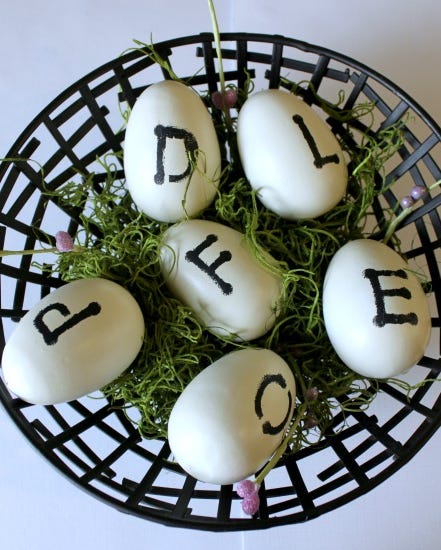 stamped eggs decorative eggs arranged in a basket with moss