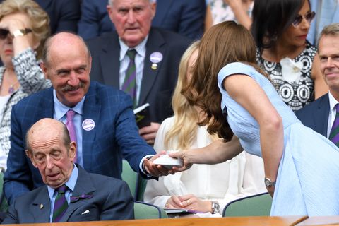 Stan Smith hands Kate Middleton a sneaker for Louis.