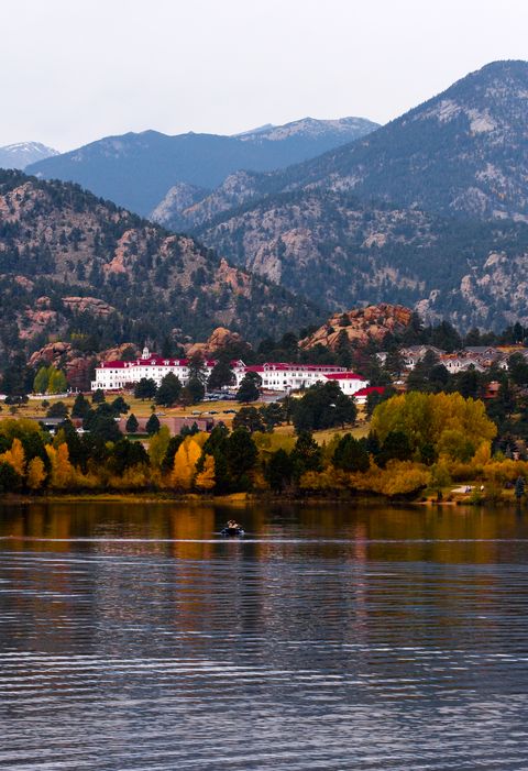 the stanley hotel surrounded by autumn trees