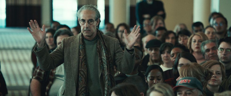 stanley tucci as charles wolf, worth