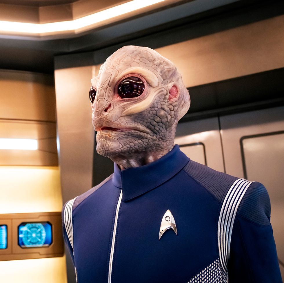 star trek discovery crew member onboard ship wearing blue starfleet suit, season 2