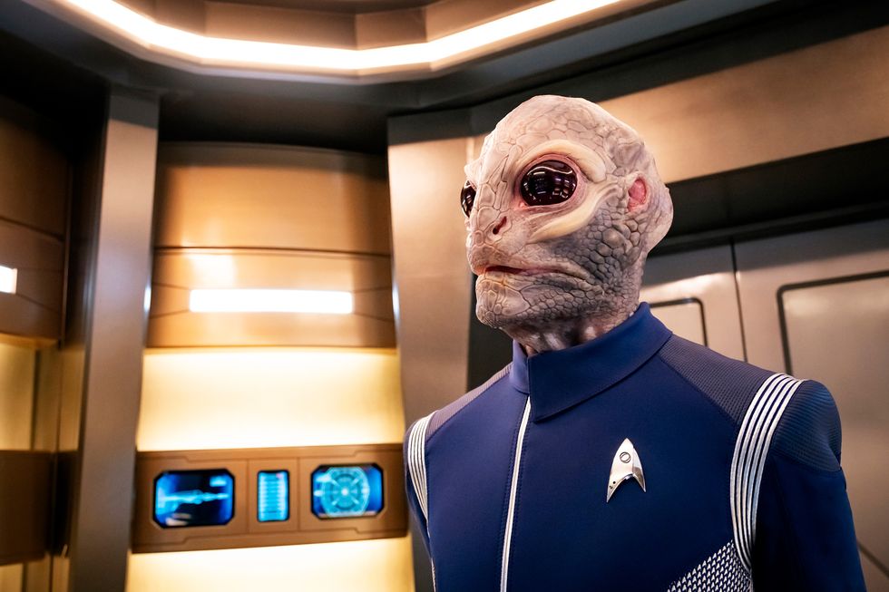 star trek discovery crew member onboard ship wearing blue starfleet suit, season 2
