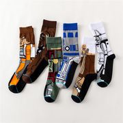 socks laying on white surface with star wars figures on them