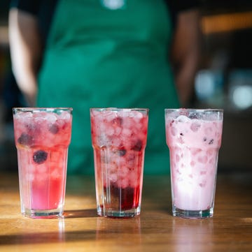 three colorful beverages in tall glasses on a wooden table three colorful beverages in tall glasses on a wooden table