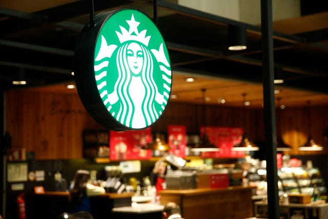 Starbucks coffee restaurant logo seen at Lisbon Portela...