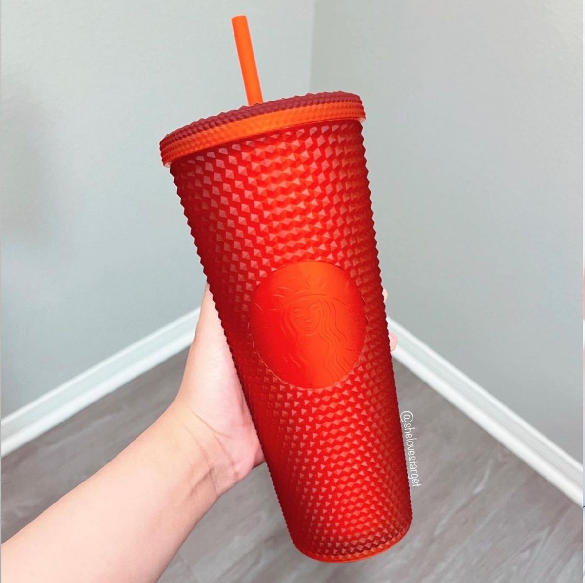 https://hips.hearstapps.com/hmg-prod/images/starbucks-coral-matte-studded-cup-1605729485.jpg?crop=0.502xw:1.00xh;0,0&resize=1200:*