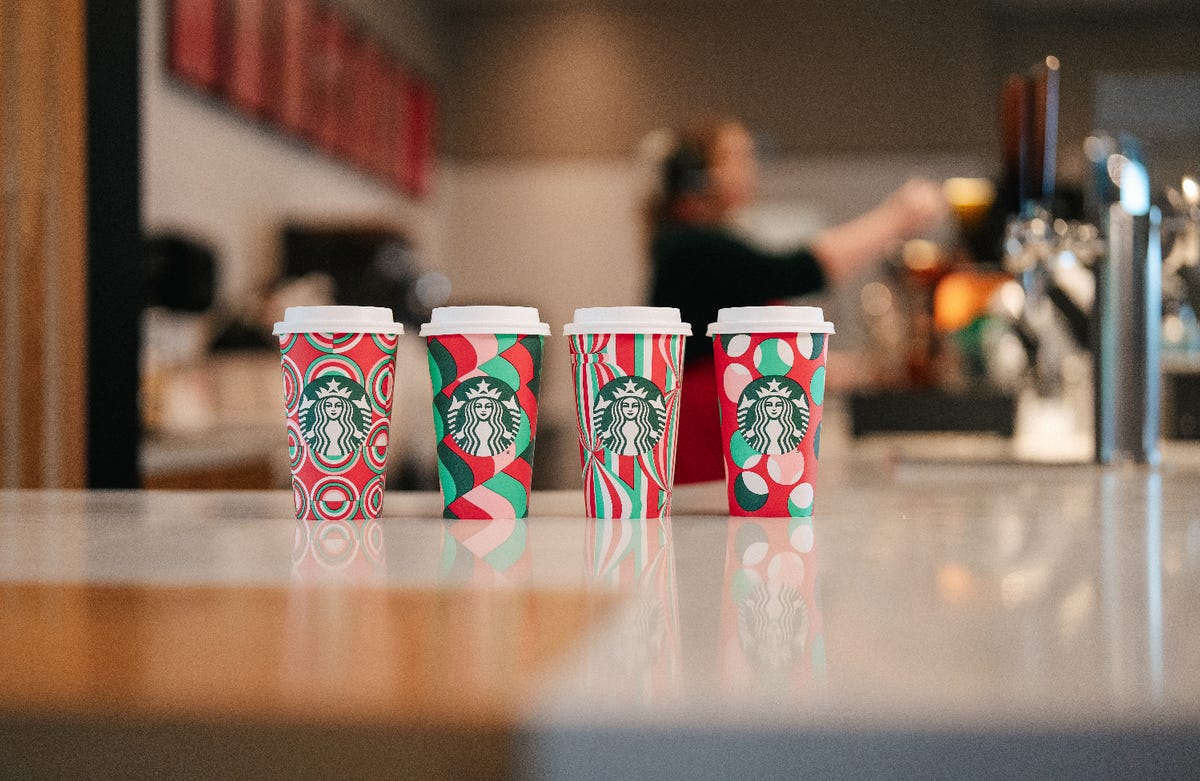 preview for Here's A Look Back At 21 Years Of Starbucks Holiday Cups