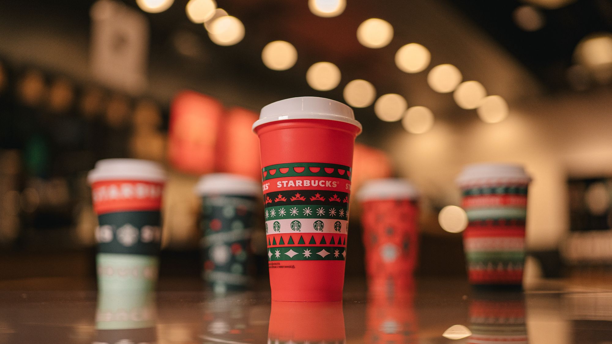 https://hips.hearstapps.com/hmg-prod/images/starbucks-holiday-cups-with-collectible-cup-jpg-1604521672.jpg?crop=1xw:0.8439609902475619xh;center,top