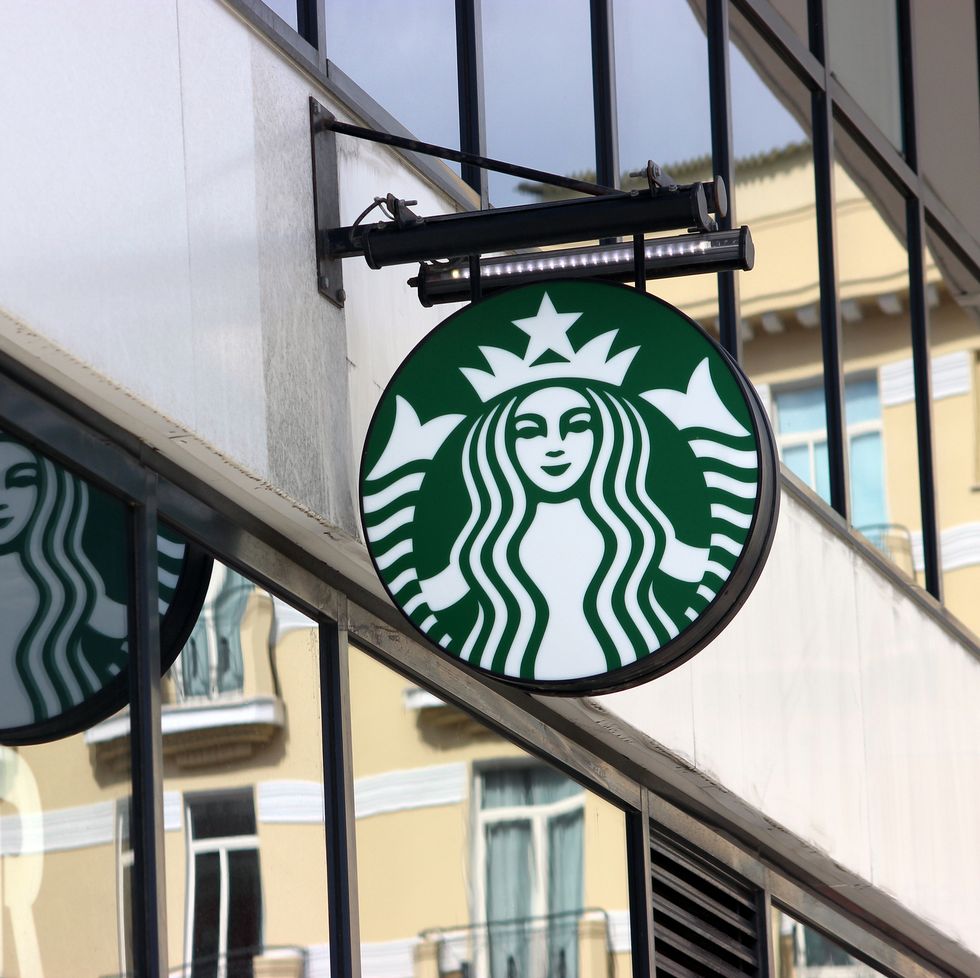 monte carlo, monaco   march 9, 2016 starbucks sign is displayed at the facade of a starbucks store starbucks corporation is an american coffee company and the largest coffeehouse company in the world with 23,450 stores in 67 countries