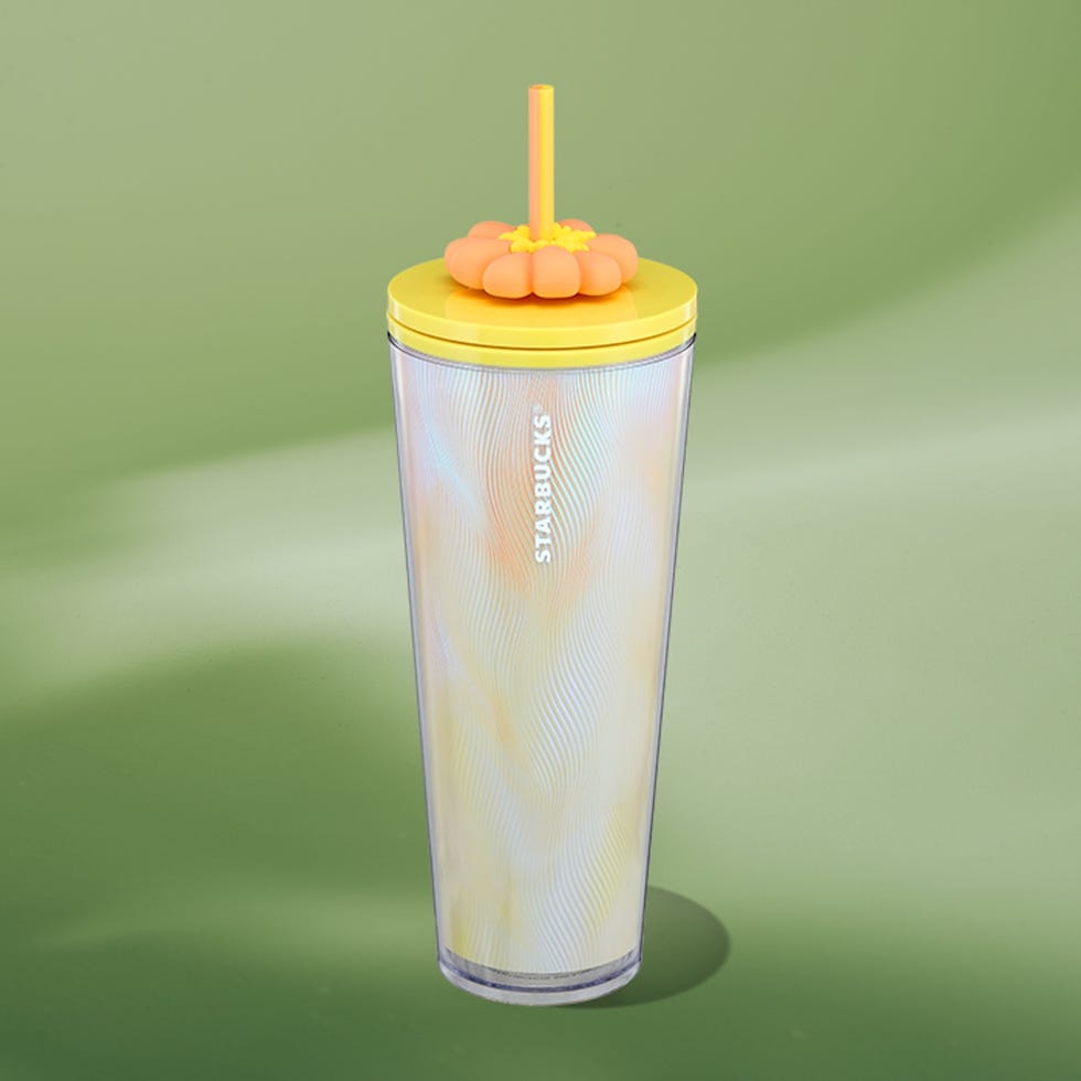 reusable tumbler with a floral shaped lid and straw