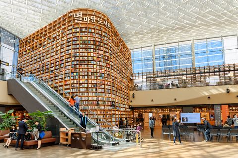 seoul, south korea   october 14, 2017 view of huge bookshelves in starfield library of seoul thousands of books and magazines are available for visitors to read in the popular public library