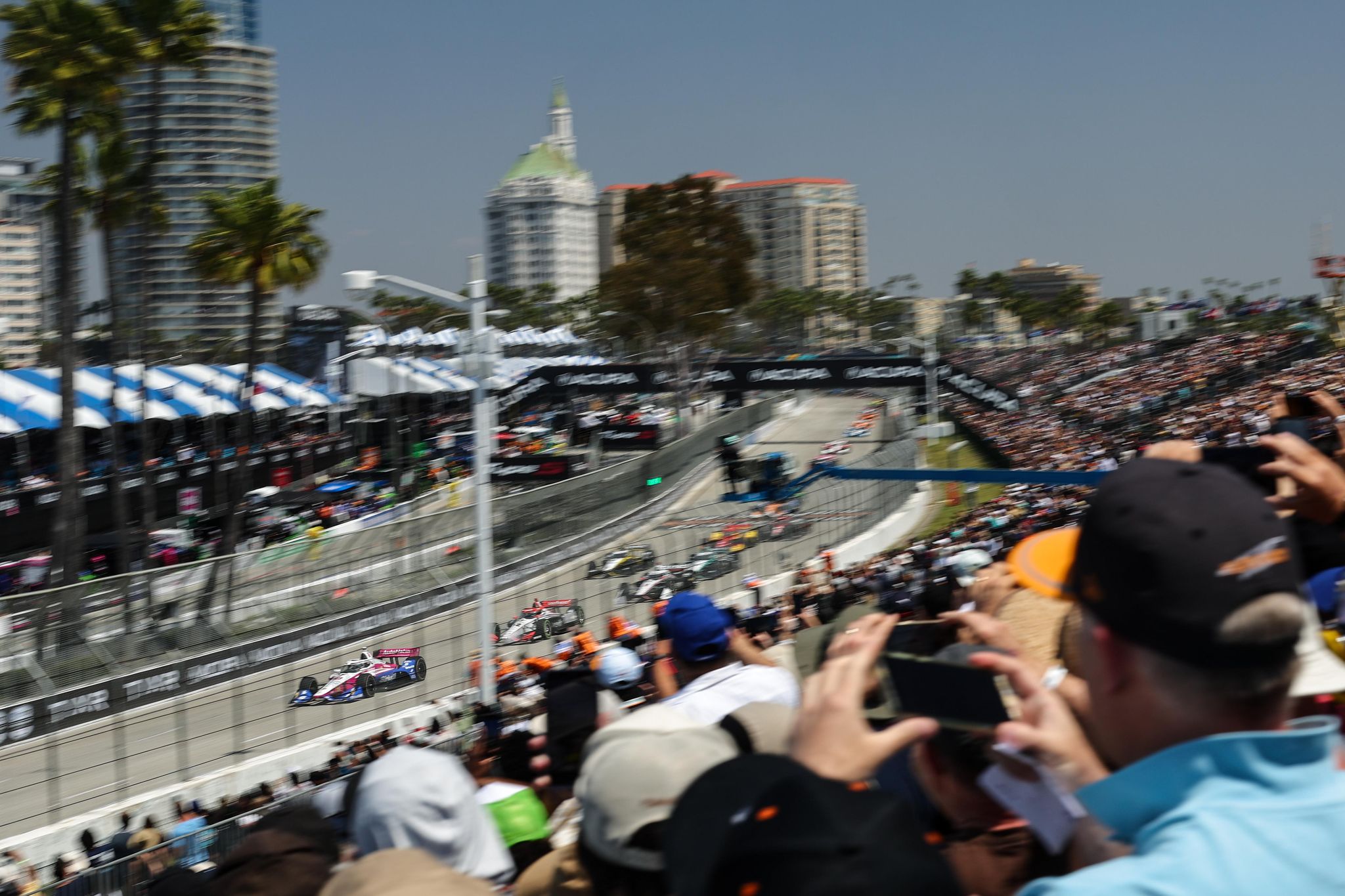 a crowd of people watching a race