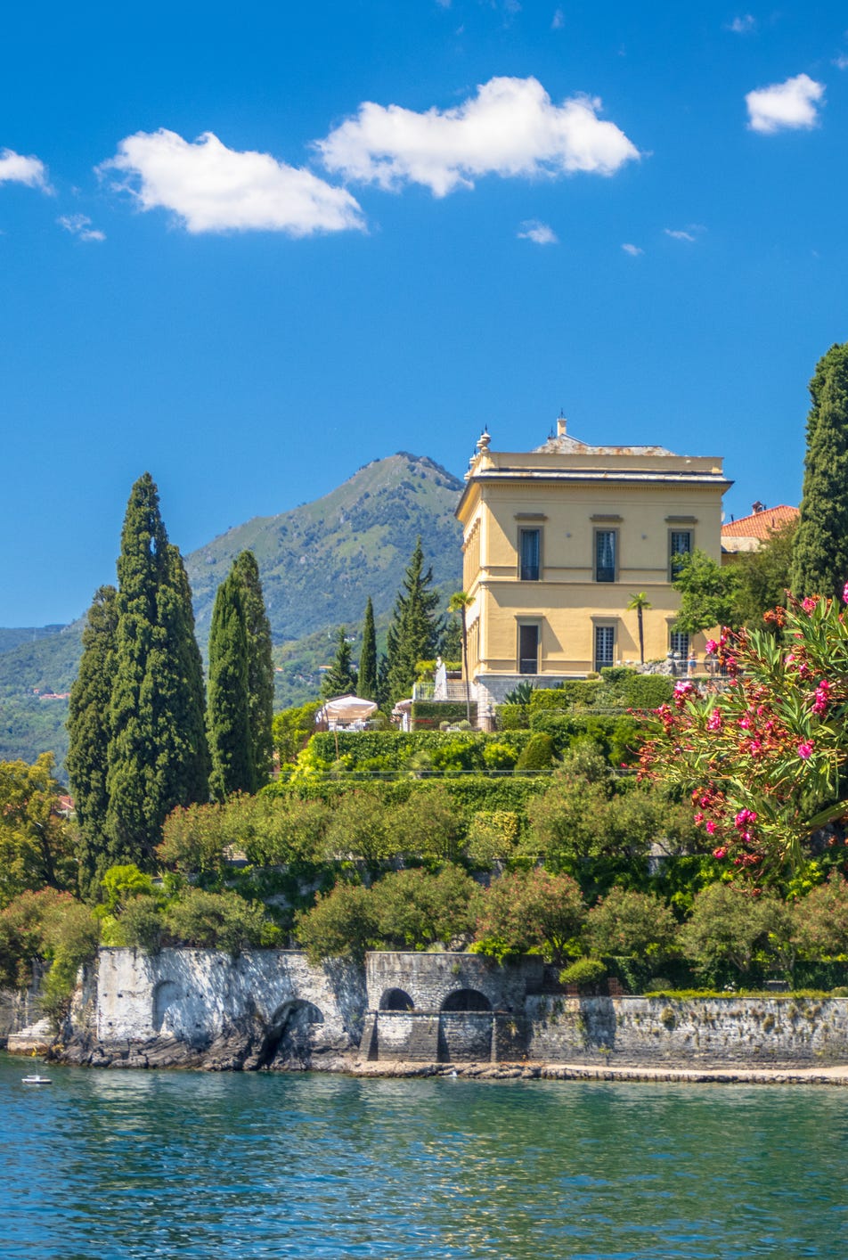 varenna, lombardy, italy july 2022 statue in villa monastero overlooking lake como