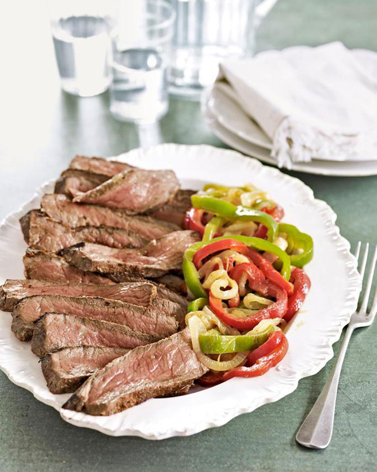 steaks with peppers and onions
