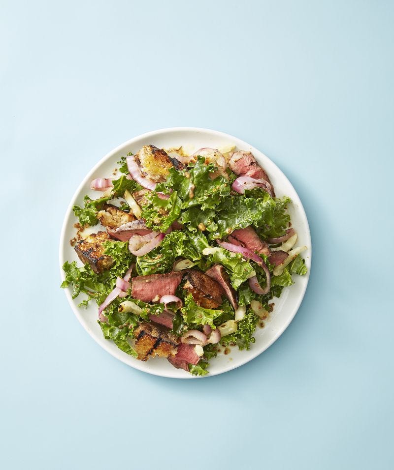 steak and rye panzanella on a white plate