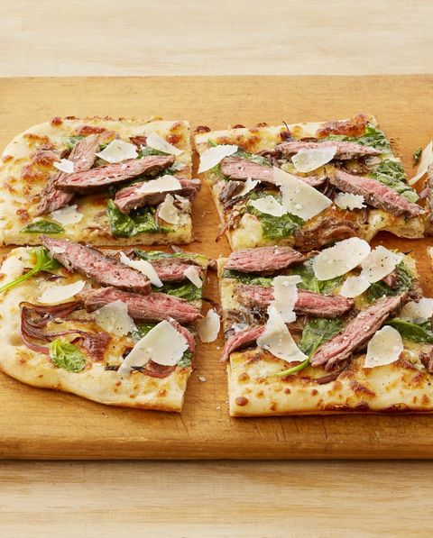 steakhouse pizza with blue cheese on wood board