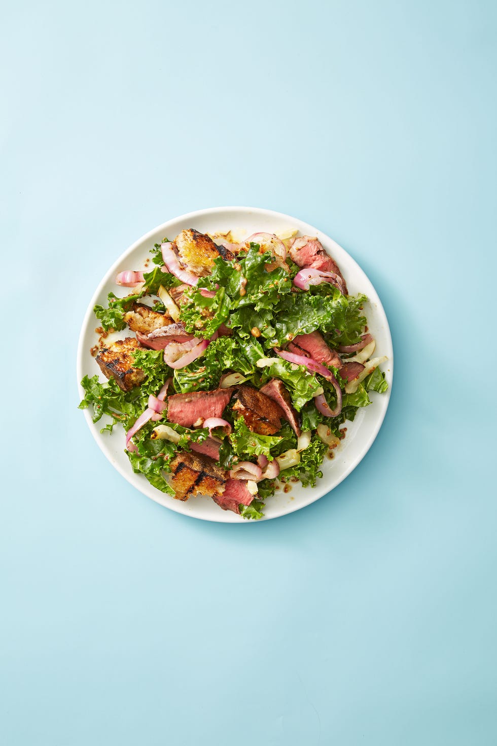 steak and rye panzanella thanksgiving salad on a white plate