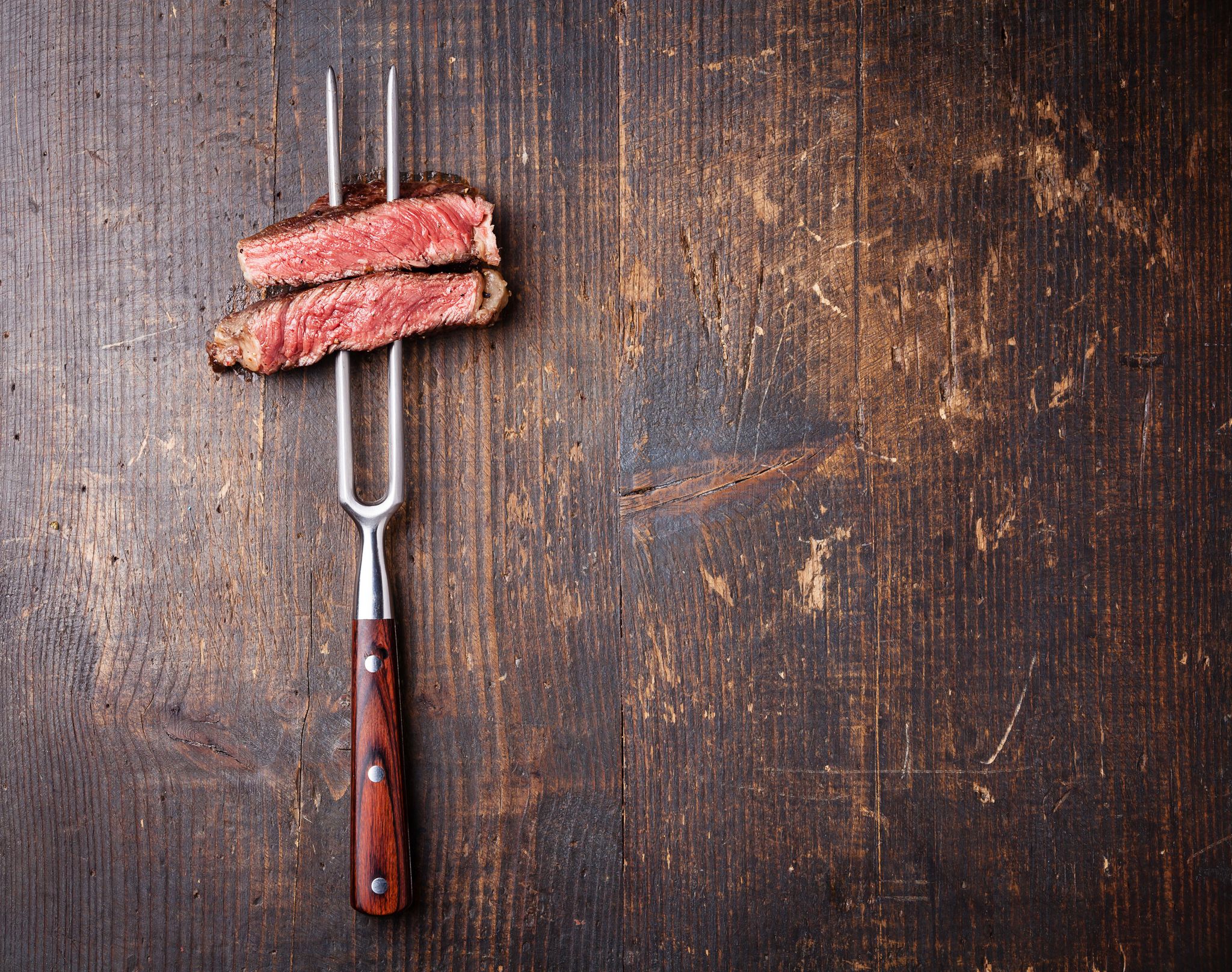 Why It Can Be Dangerous To Cut Meat On A Wooden Board