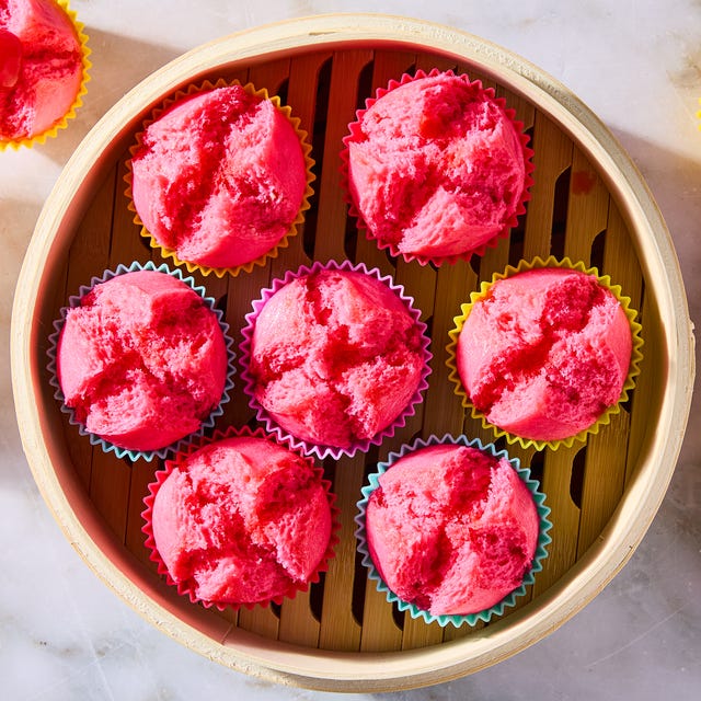 blooming pink cupcakes topped with maraschino cherries