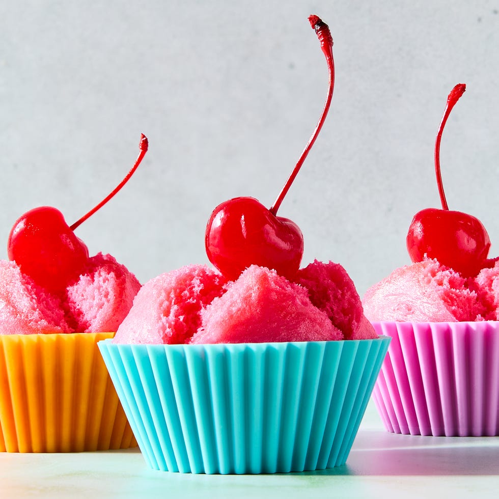 blooming pink cupcakes topped with maraschino cherries