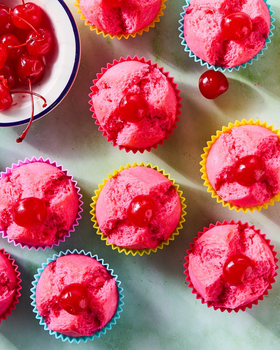blooming pink cupcakes topped with maraschino cherries