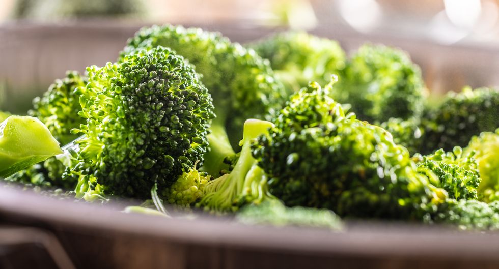 steamed broccoli in a stainless steel steamer close up healthy vegetable concept